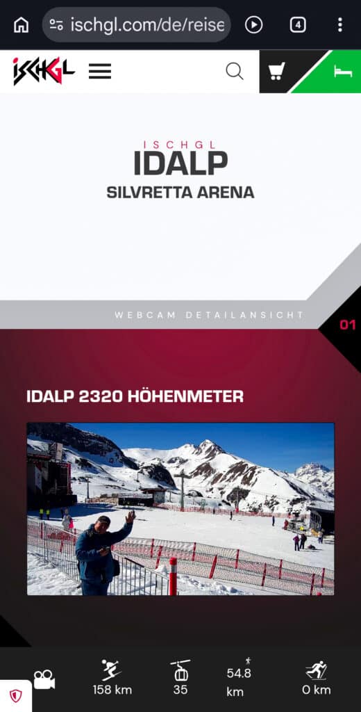 Webcam-Screenshot der Idalp-Bergstation mit Reiseblogger Daniel Dorfer im Bild beim Saisonfinale Ischgl 2026