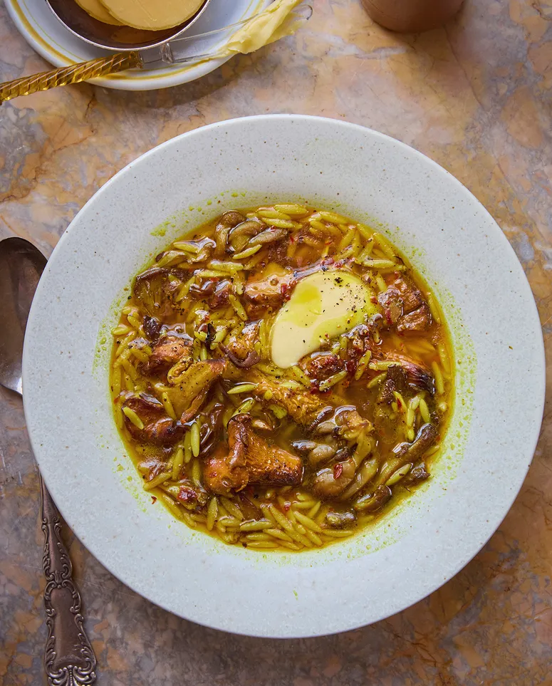 Golden mushroom soup in a white bowl
