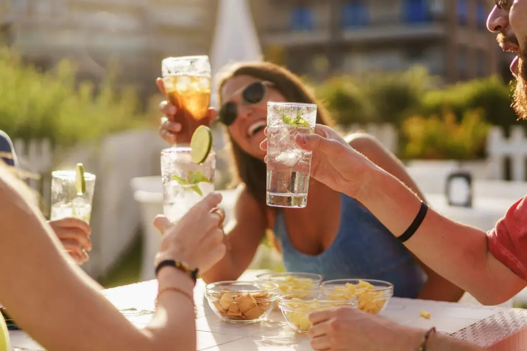 Friends enjoying tequila based cocktails together