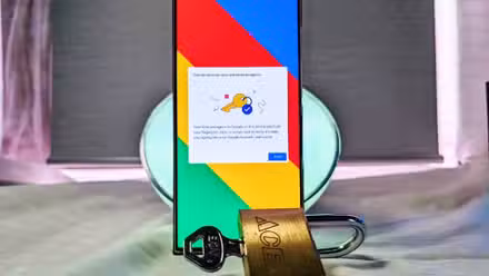 Samsung Galaxy S23 Ultra with confirmation on the screen beside a padlock and key