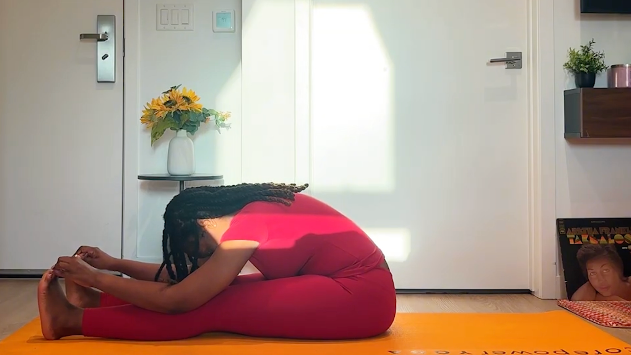Ramoni Overton practicing seated forward fold.