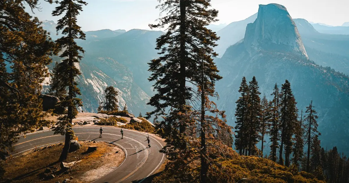 People walk around the road at Yosemite National Park