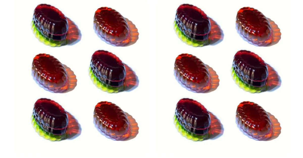 Brightly colored Jell-O molds sit on a white backdrop 