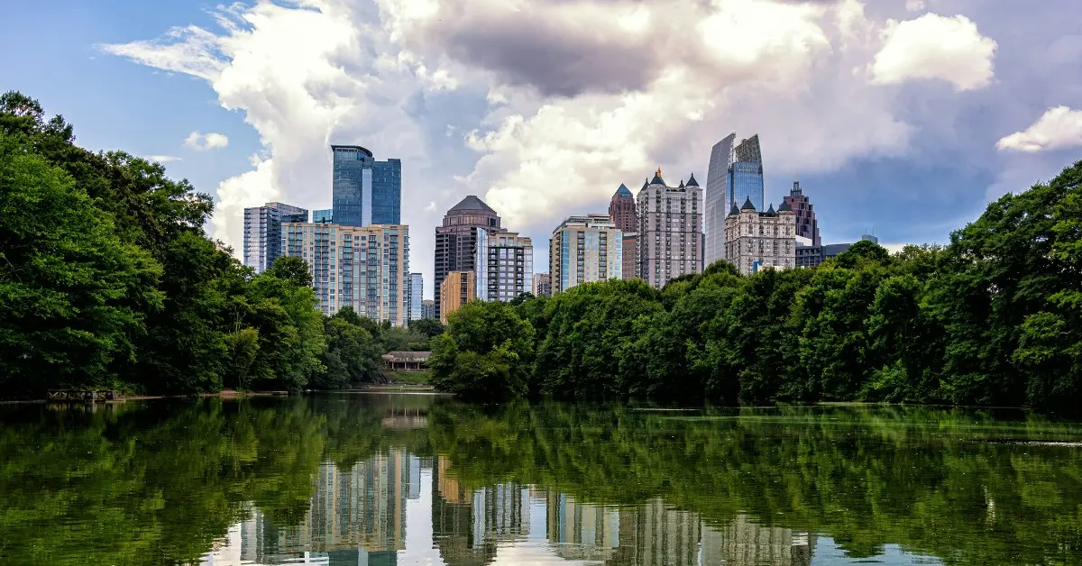 The Atlanta skyline appears behind a reflective lake