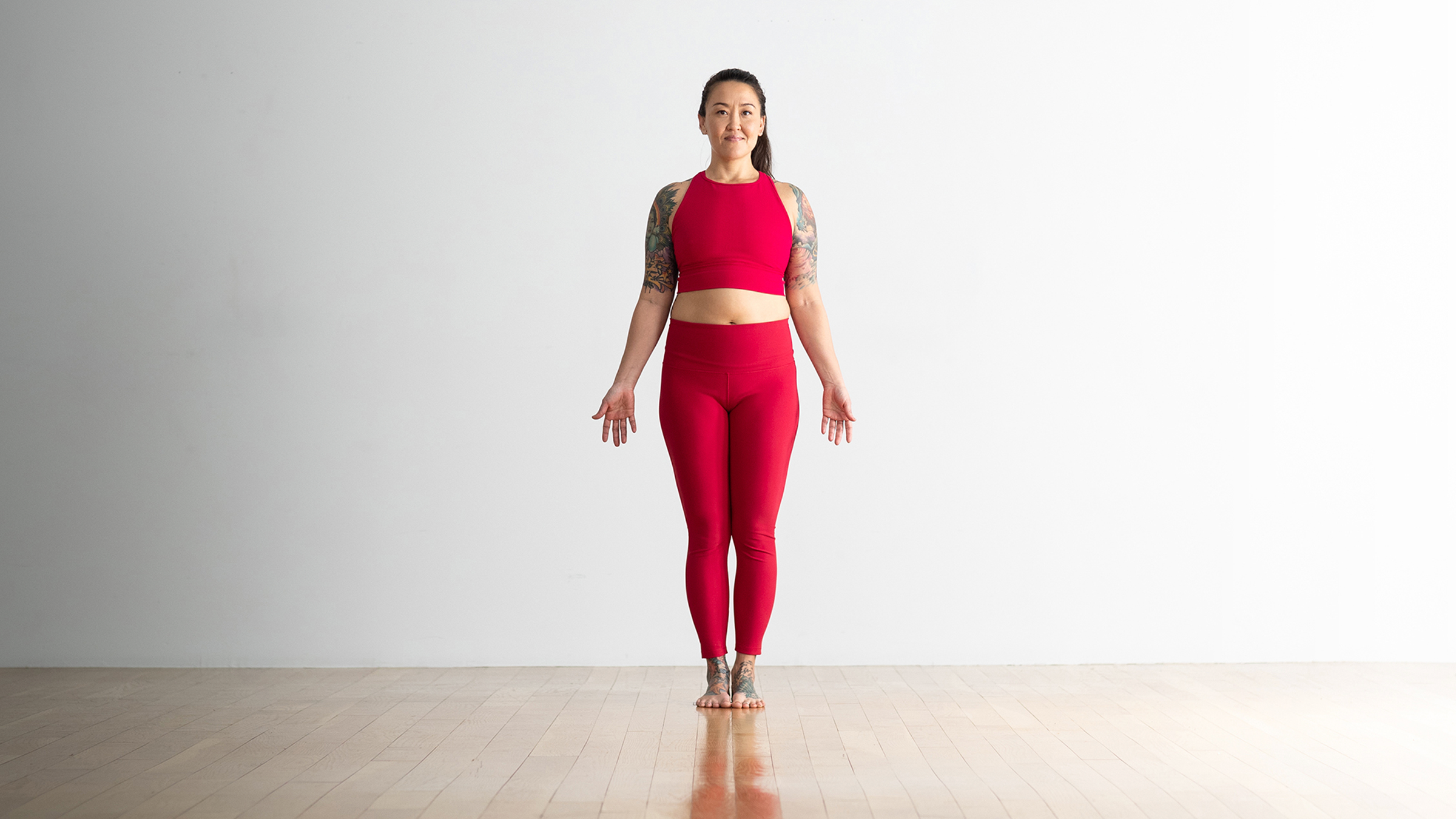 A woman in Mountain Pose, one of the most foundational yoga poses