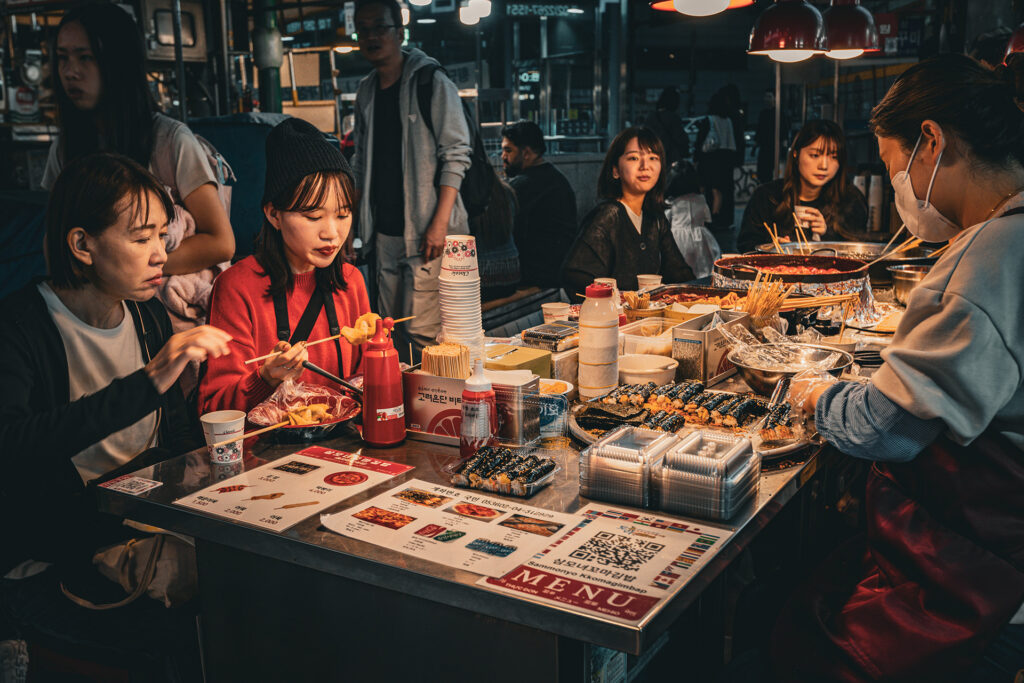 People dining on the Gwangjang Market one of the biggest food markets in Seoul.