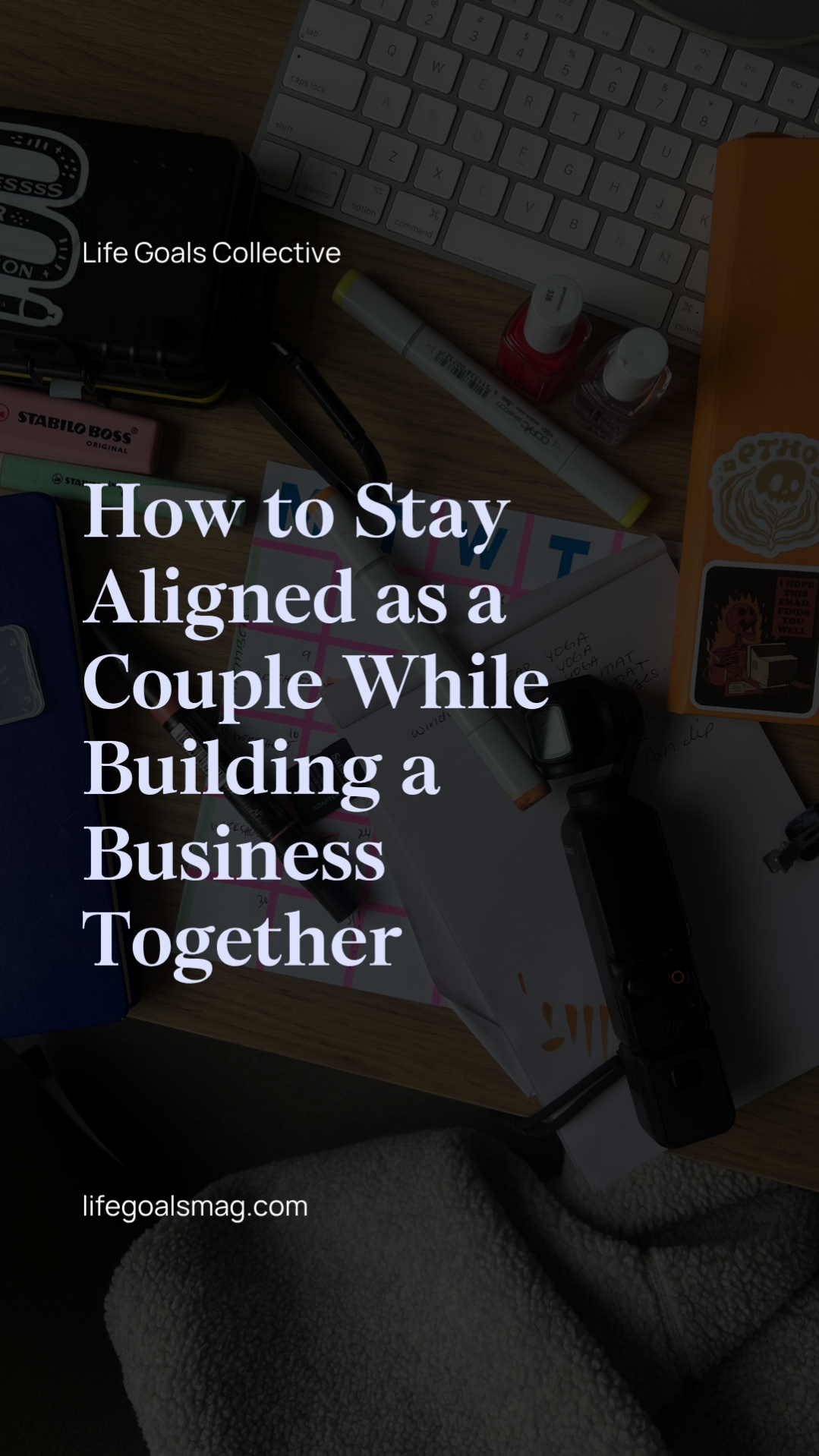Creative workspace with a keyboard, planner, markers, and content creation tools on a desk. Text overlay says “How to Stay Aligned as a Couple While Building a Business Together.”