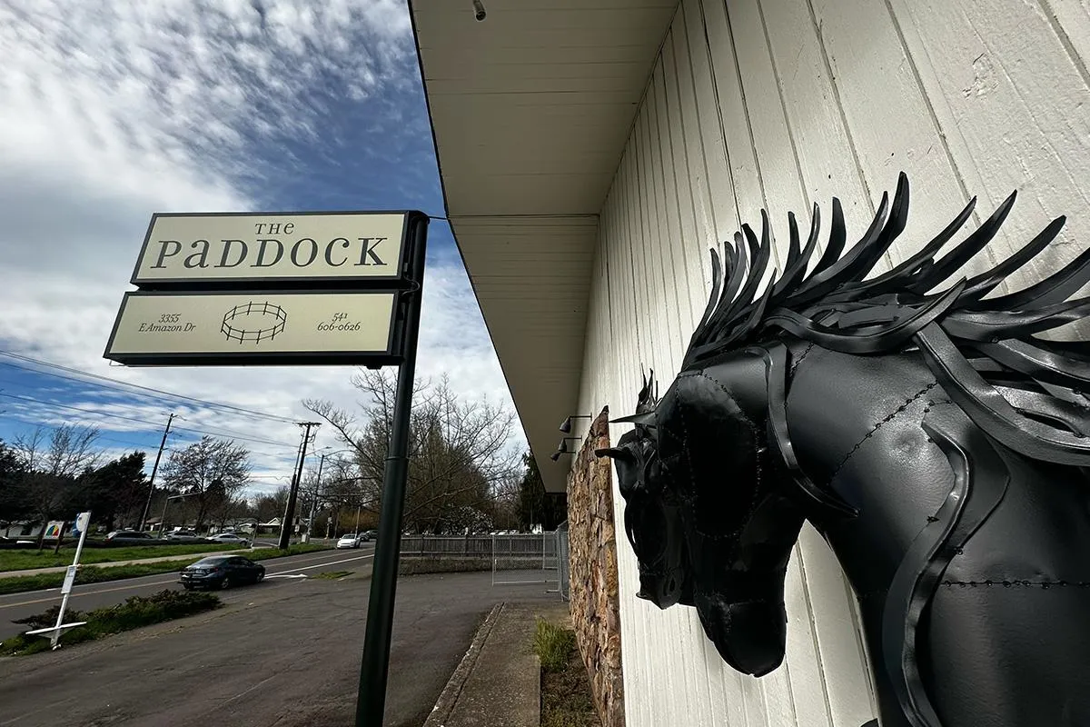 The Paddock restaurant exterior with a horse sculpture