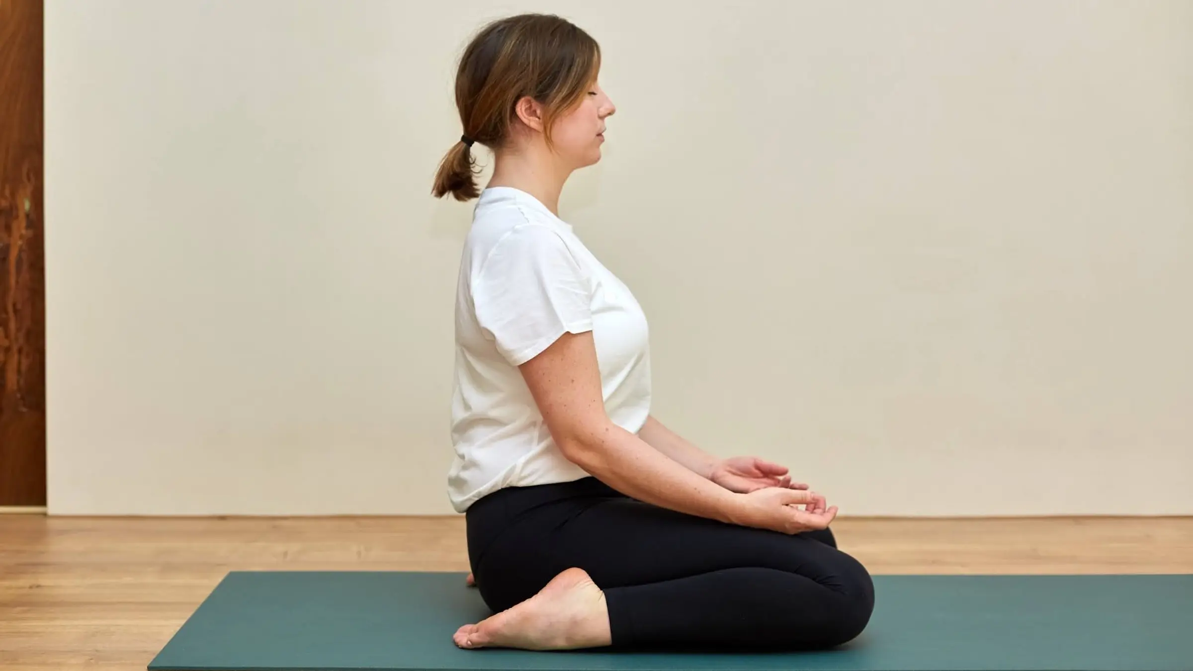 A woman in Saddle Pose