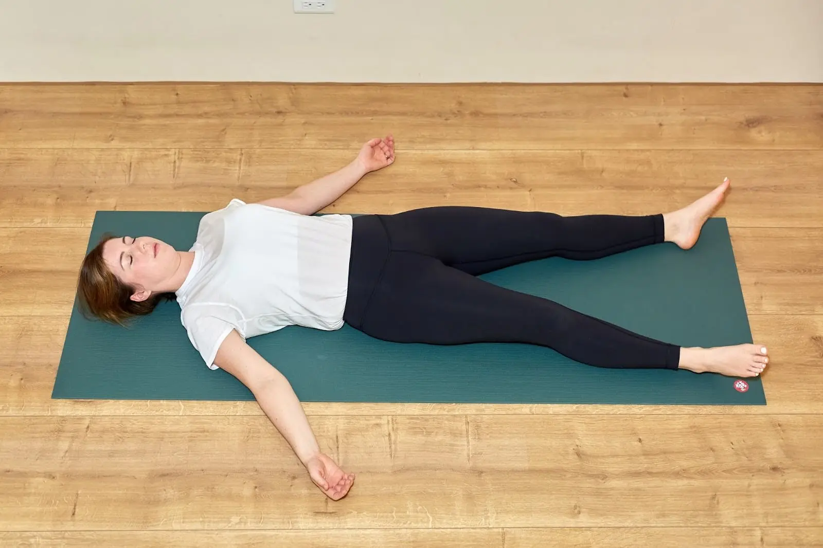 Yin yoga teacher Katie McGrath in Corpse Pose