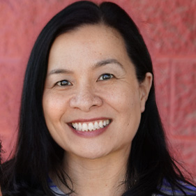 Oanh Meyer smiles at camera