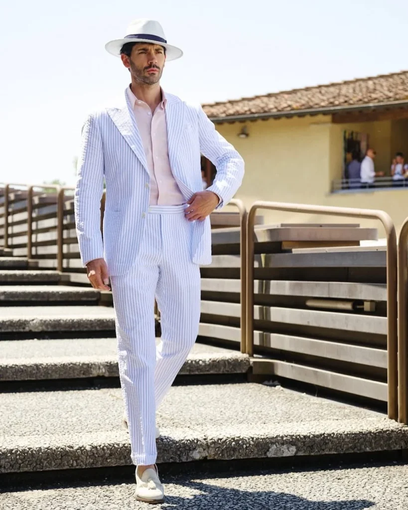 sky blue striped seersucker suit with pink linen shirt and beige tassel loafers