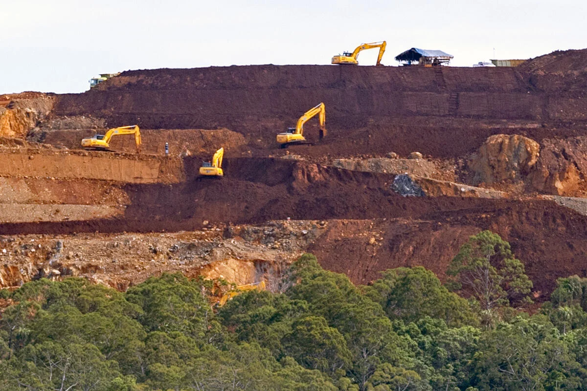 Heavy machinery operates at the nickel mining site of PT Kawei Sejahtera Mining on Kawe Island, West Waigeo District, Raja Ampat Regency, Southwest Papua Province, Indonesia.

The concession covers an area of 5,922 hectares and is located within the mega-biodiversity region of Raja Ampat, West Papua. Visible sedimentation from nickel mining activities poses a serious threat to coral reefs and marine ecosystems.
